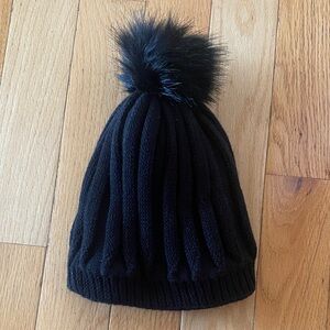 Woman’s Black Pom-Pom Beanie